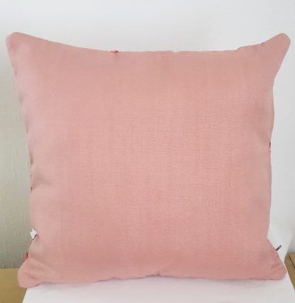 dos coussin rose